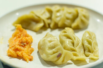 Momo , type of South Asian dumpling; native to Tibet, Nepal, Bhutan and Sikkim. It is similar to...