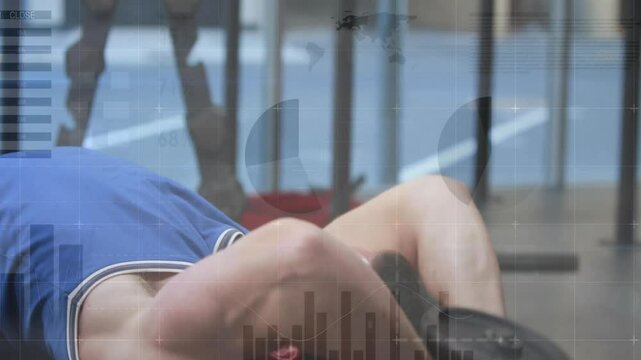 Male athlete gripping dumbbell and performing pullovers on bench, strengthening chest in gym