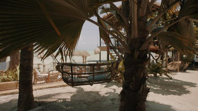 Swinging hammock bench at Zanzibar resort.