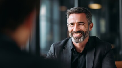 Fototapeta premium Confident businessman in formal suit smiling and having meeting with collegue 
