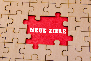 Puzzle pieces with new goals in red background