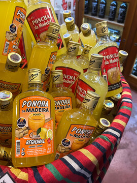 Bottles of poncha on a store shelf. Close-up. Funchal. Madeira. Portugal.