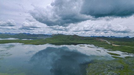 Cloudy day over a large lake and the Andean highlands in southern Peru.