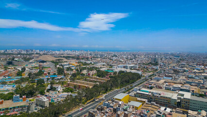 Aerial view of Cercado de Lima with a wide avenue on a sunny summer day.