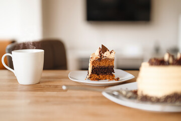 Coffee and dessert create a delightful afternoon experience in a cozy kitchen setting