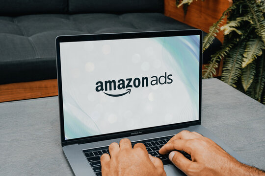 Marketing professional working on amazon ads campaign using laptop
