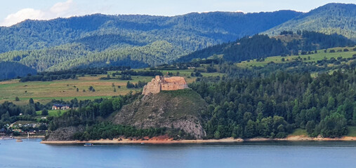 Fototapeta premium Castle in Niedzica, forest and landscape by the river with the mountains