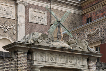 An architectural detail featuring a miniature windmill on a historic building, the Museum De Lakenhal in Leiden. This heritage highlights Dutch ingenuity. Leiden, Netherlands, 4 May 2025.