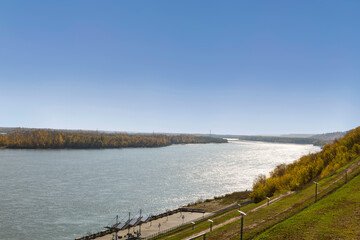 Autumn view of the Ob River and the city embankment from the height of the Nagorny Park. The city of Barnaul. Altai Territory