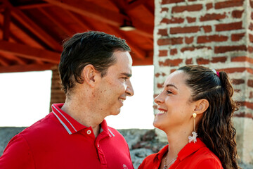 Young couple in Cartagena de Indias. Couple dressed in red. Love concept. Travel concept.