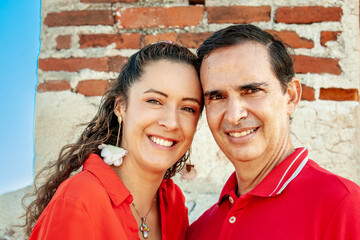 Young couple in Cartagena de Indias. Couple dressed in red. Love concept. Travel concept.