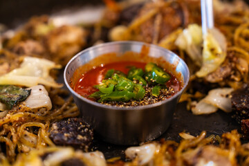 spicy chili pepper sauce at the stir-fried Korean blood sausage