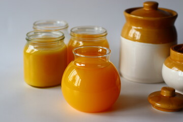 Homemade Cow Ghee. A clarified butter made by slow heating butter, creating a golden, clear liquid with a rich aroma