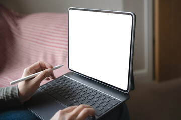 Businesswoman hand holding stylus pen working on digital tablet with white blank touch screen,Close up freelance designing on computer graphic tablet with electronic pen during working online at home