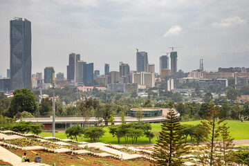 Rapid development of central business district with modern skyscrapers of downtown of Addis Ababa and green park in the foreground, Ethiopia