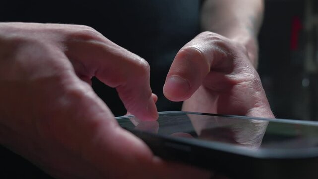 sending sms.
A man in a chat writes a text message and sends it.
Close-up of the smartphone keyboard.
A man uses a mobile phone for correspondence - Powered by Adobe