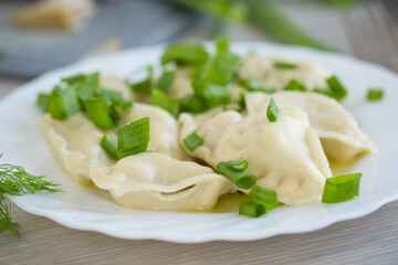 Homemade dumplings with potato filling and fresh herbs