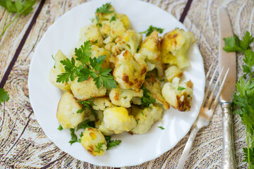 Rustic vegetable dish with cabbage and herbs, top view