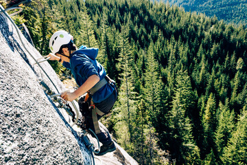 Climber on a cliff, Via Ferrata, Sea to Sky , Squamish, British Columbia, Canada