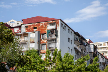 Residential apartment buildings with weathered facades in urban area