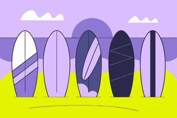 Colorful surfboards standing on the beach at sunset 