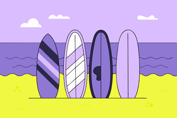 Colorful surfboards standing on the beach at sunset 