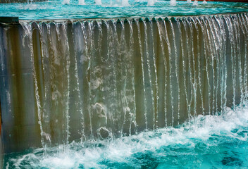water flowing from a fountain in the park