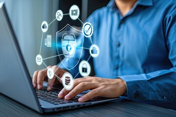Man Typing on Laptop with Cybersecurity Shield and Icons Overlayed, Blue Shirt