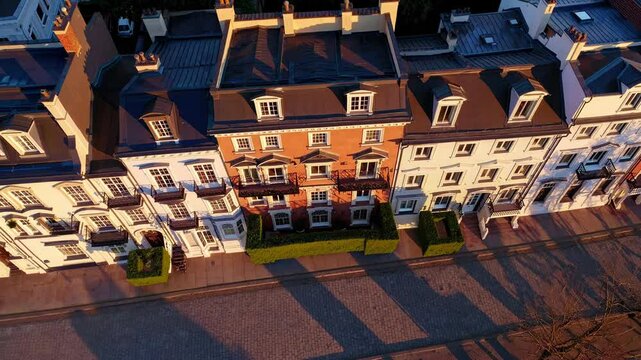  Elegant row of townhouses captured at sunset from aerial view