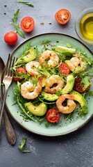 Fresh Shrimp Salad With Avocado and Cherry Tomatoes Served on a Green Plate