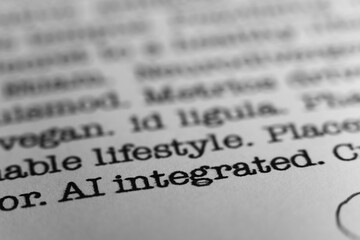 Fototapeta premium AI integrated. Text printed on a page. A piece of paper with a phrase written in retro typewriter font