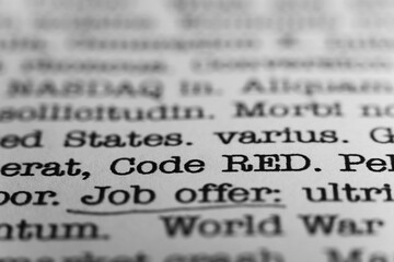 Code RED. Text printed on a page. A piece of paper with a phrase written in retro typewriter font