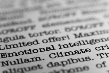 Emotional intelligence. Text printed on a page. A piece of paper with a phrase written in retro typewriter font