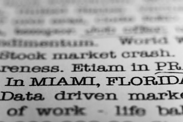 In Miami Florida. Text printed on a page. A piece of paper with a phrase written in retro typewriter font