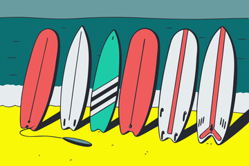 Surfboards lined up on sandy beach with ocean in the background  