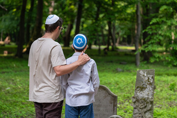 ancestors, boy in kippah, father, son, lay stone, ancestors, grave	