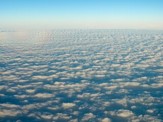 Aerial view of a sea of clouds with a circular glory in the sky