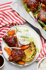 Five Spice Chicken Sheet Pan with teriyaki  sauce, vegetables and rice.selective focus
