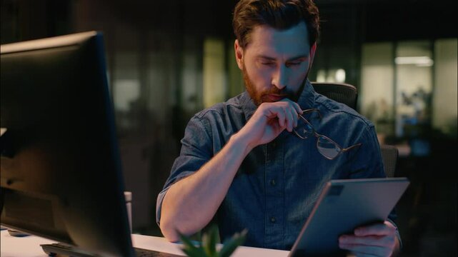Caucasian middle-aged businessman stock market trader business man broker computer trading analyst CEO manager in night evening office professional employer in glasses tired overtime working overwork