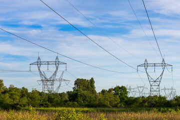 High voltage pylon in the French countryside. 400 kV High voltage electric power grid.