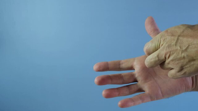 Healing patch that prevents infection and suppuration of wound. Man's hand. Symbol Like, thumb up.  Antibacterial Band-Aid impregnated with brilliant green solution, syntomycin and furacilin.