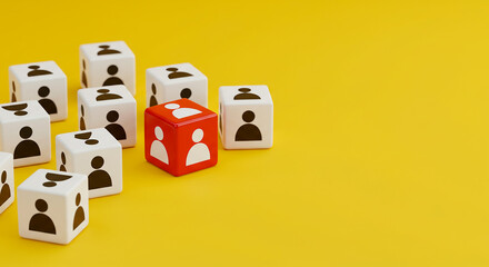 Obraz premium Group of white and red dice with person icons on a yellow background in a studio shot close up view