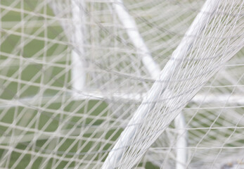 Close up of soccer net draped around the goal