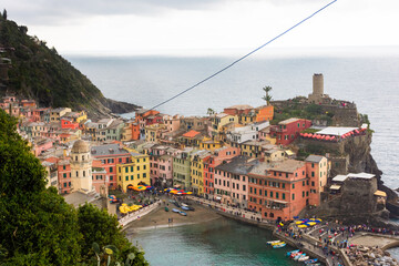 View of the colorful town of Vernazza under a cloudy sky, Cinque Terre, Liguria,  Italy