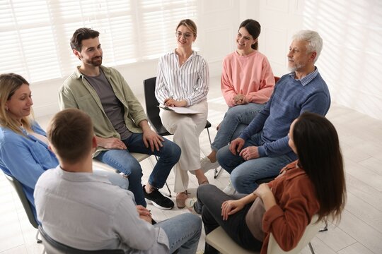 Group of people having psychotherapy session indoors, above view