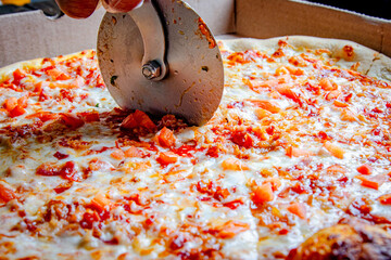 Tasty Italian pizza with spinach, pepperoni, cheese, and mushrooms
