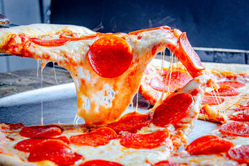 Tasty Italian pizza with spinach, pepperoni, cheese, and mushrooms