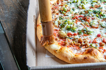 Tasty Italian pizza with spinach, pepperoni, cheese, and mushrooms