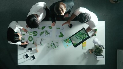 Top view of manager hold tablet display clean energy investment at meeting. Aerial view of skilled business team working together and planning to use sustainability environmental energy. Alimentation.