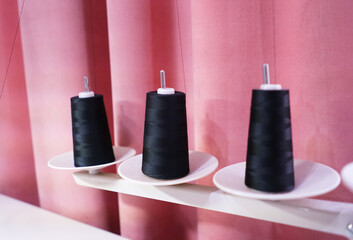 Black threads in a sewing workshop. 